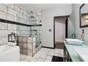 Modern bathroom with a separate shower and tub, dual sinks, and stylish tile work at 3223 Thornecreek Dr, Douglasville, GA 30135