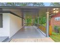 Large covered back porch with painted railings, providing ample outdoor space at 2720 Cavalier Dr, Decatur, GA 30034