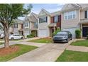 Well-maintained townhouse complex with neat lawns, paved driveways, and a welcoming curb appeal at 359 Azalea Cir, Cumming, GA 30028