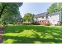 Large backyard with a wooden deck perfect for outdoor entertaining and relaxation at 366 Coopers Pond Dr, Lawrenceville, GA 30044
