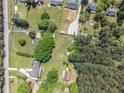 Large lot with wooded acreage, a long driveway and an established house at 1797 Chandler Rd, Lawrenceville, GA 30045