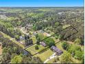 Beautiful acreage featuring an established home, treed acreage and long private driveway at 1797 Chandler Rd, Lawrenceville, GA 30045
