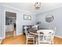 Charming dining area with a round table and views into the kitchen at 4913 Farm Valley Ne Dr, Woodstock, GA 30188