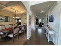 Elegant dining room with a large table, chandelier, and views into the living spaces at 719 Lilac Mist Dr, Loganville, GA 30052