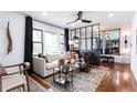 Cozy living room with large windows, modern furnishings, and stylish accents at 2047 Seavey Dr, Decatur, GA 30032