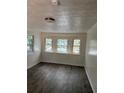 Well-lit bedroom with new wood floors, white walls, and charming decorative window films at 2095 Mulkey Sw Rd, Marietta, GA 30008