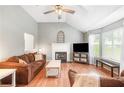 Cozy living room with vaulted ceilings, fireplace, hardwood flooring and great natural light at 7108 Hummingbird Ln, Winston, GA 30187
