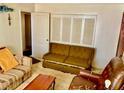 Photo shows the arrangement of various pieces of furniture and doors within the living room area at 1968 Don Juan Ln, Decatur, GA 30032
