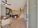 Inviting open-concept living space with hardwood floors, a staircase, and stylish decor at 454 Connally Se St, Atlanta, GA 30312