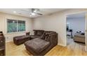 Comfortable living room with modern ceiling fan, hardwood floors, and neutral paint at 1841 Mobley St, Austell, GA 30106
