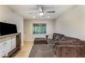 Inviting living room with contemporary lighting, hardwood floors and a cozy sectional couch at 1841 Mobley St, Austell, GA 30106