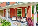 Inviting front porch with comfortable seating and decorative plants at 5388 Silver Springs Dr, Sugar Hill, GA 30518