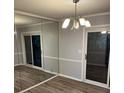 Bedroom area showcases a mirrored closet and access to outdoor space at 5540 Kingsport Ne Dr # 18, Atlanta, GA 30342