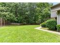 Expansive backyard with lush green grass, perfect for outdoor activities at 4908 Willow Lane Ln, Austell, GA 30106