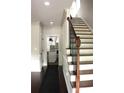 Grand entry showcasing a staircase and hardwood floors creating a welcoming and elegant atmosphere at 1062 Lena Nw St, Atlanta, GA 30314