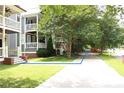 Neighborhood view showing the sidewalk with mature trees in a walkable neighborhood at 1062 Lena Nw St, Atlanta, GA 30314