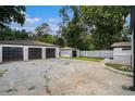 Spacious garages and parking area with multiple bays, offering ample storage and parking options at 2403 Tiffany Pl, Decatur, GA 30035