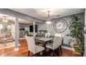 Open concept dining area with hardwood floors and stylish decor at 338 Saratoga Pl, Riverdale, GA 30296