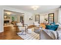 Open living room layout with hardwood floors, fireplace, and comfortable seating at 2233 Clairmont Ne Rd, Atlanta, GA 30329