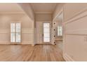 Bright, open-concept living room with wood floors and natural light at 1169 Dorby Park Ne Dr, Brookhaven, GA 30319