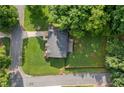 Aerial view of a home showcasing its spacious yard, mature trees, and neighborhood surroundings at 984 Ridgecrest Se Dr, Smyrna, GA 30080