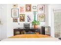 Eclectic dining room featuring gallery wall, modern furniture and natural light at 1348 Sheffield Glen Ne Way # 8, Atlanta, GA 30329