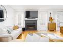 Cozy living room featuring a fireplace, TV, and comfortable seating arrangement at 1348 Sheffield Glen Ne Way # 8, Atlanta, GA 30329