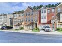 Beautifully built townhomes with attached garages, classic brick exteriors, and manicured landscaping at 4232 Perimeter E Park # 110, Atlanta, GA 30341