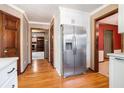 Bright kitchen with stainless steel refrigerator and views into multiple rooms showcasing an open layout at 929 Hampton Nw Trl, Lilburn, GA 30047