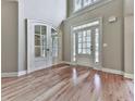 Grand foyer with soaring ceilings, hardwood floors, and elegant double doors at 310 River Birch Ct, Canton, GA 30114