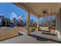 Inviting front porch with comfortable swing, perfect for relaxing and enjoying the outdoors at 5143 Floyd St, Covington, GA 30014
