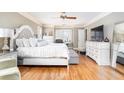 Spacious main bedroom suite with hardwood floors, stylish furnishings, and a serene atmosphere at 5936 Millstone Ln, Stone Mountain, GA 30087