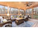 Inviting screened porch with comfortable seating and scenic views, perfect for relaxation at 5936 Millstone Ln, Stone Mountain, GA 30087