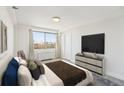 Bedroom featuring a large window with city views and neutral decor at 2479 Peachtree Ne Rd # 1703, Atlanta, GA 30305