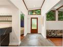 Inviting foyer with stone floors, high ceilings and exposed wood accents at 1164 Bonview Ne Ln, Atlanta, GA 30324