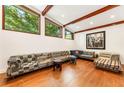 Bright living room with hardwood floors, exposed beams, and ample natural light at 1164 Bonview Ne Ln, Atlanta, GA 30324
