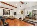 Open-concept living room featuring a stone fireplace and seamless flow at 1164 Bonview Ne Ln, Atlanta, GA 30324