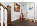Welcoming foyer featuring hardwood floors, staircase and stylish decor at 1967 Cogar Dr, Decatur, GA 30032