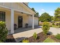 Inviting front porch with elegant columns and well-maintained landscaping at 1967 Cogar Dr, Decatur, GA 30032