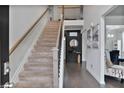Inviting entryway with hardwood floors, staircase, and elegant decor at 3586 Maple Hill Rd, Stonecrest, GA 30038