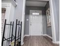 Inviting entryway with a white front door and wood-look flooring at 6391 Katherine St, Douglasville, GA 30134