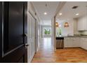 Inviting entryway with light hardwood floors leads to a modern kitchen and bright, open living space at 2255 Peachtree Ne Rd # 620, Atlanta, GA 30309