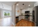 Well-equipped kitchen with stainless steel appliances and bright breakfast bar extends to a living room view at 2255 Peachtree Ne Rd # 620, Atlanta, GA 30309