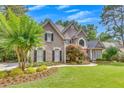 Beautiful home with lush landscaping and inviting walkway, showcasing curb appeal at 407 Amber Ln, Woodstock, GA 30189