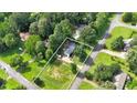 An aerial view of a single-Gathering home with large, well-maintained yard and mature trees in established neighborhood at 6918 Heritage Pl, Acworth, GA 30102