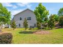 A spacious backyard with green grass, bordered by a black fence, creating an inviting outdoor space at 4583 Grenadine Cir, Acworth, GA 30101
