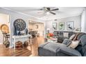 Stylish living room featuring a large sectional sofa, hardwood floors, and gray walls at 46 Le Parc Fontaine, Lithonia, GA 30038