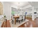 Elegant dining area featuring hardwood floors, modern lighting, and an open layout at 5534 Parkerton Ln, Sandy Springs, GA 30342