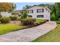 Home exterior featuring a driveway and a side entry garage at 1083 Amelia Sw Dr, Marietta, GA 30060