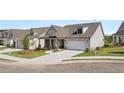 Beautiful home with a two-car garage and landscaped front yard provides great curb appeal at 1629 Tielman Way, Snellville, GA 30078
